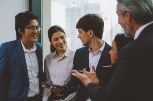 Business employee talking and meeting with co-worker team to plan business project in modern office among business officer people, Financial Department office, Employee with financial report analyze